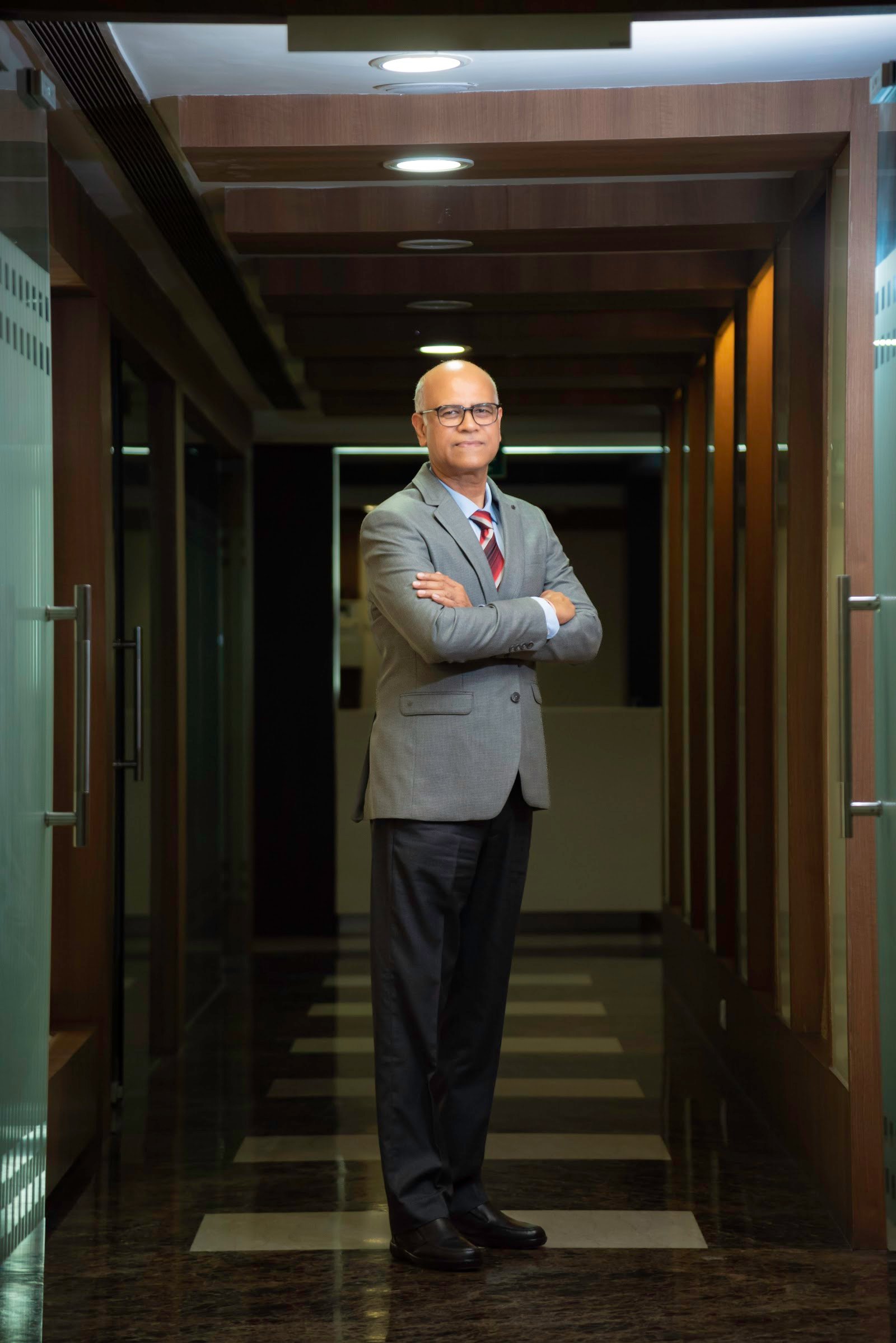 executive portrait photography in a corporate office hallway in Gurgaon